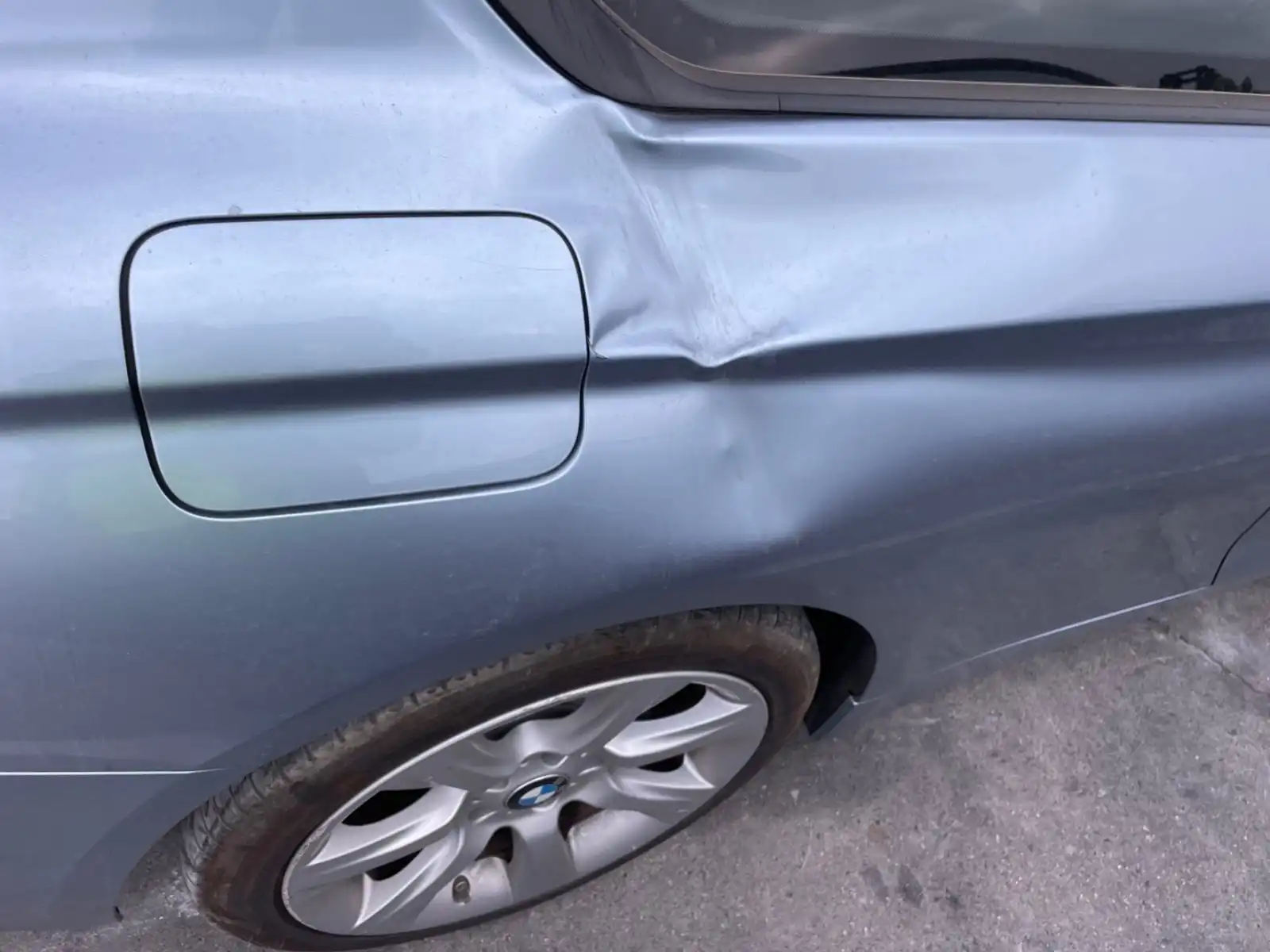 A dent next to the fuel door